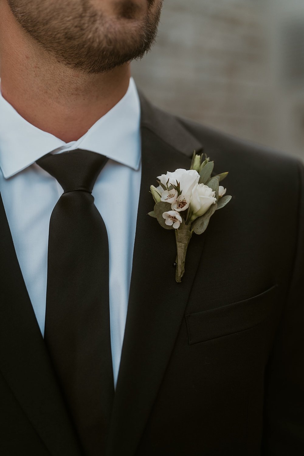 Detail photo of the grooms boutonnière. 