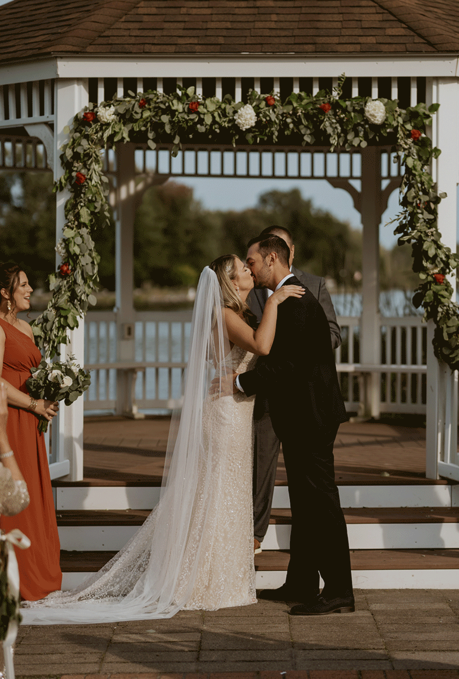 The groom kisses his bride after they say "I do".