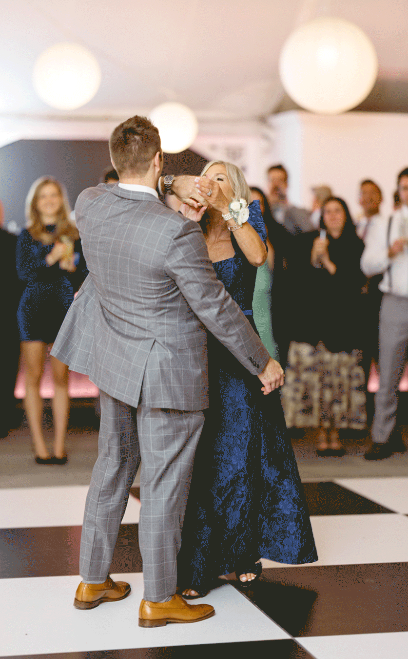 The groom and his mother share a dance together. 