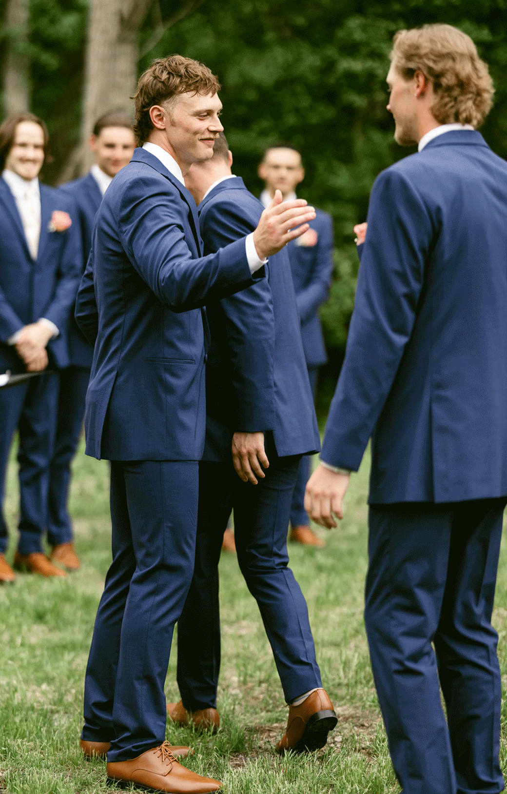 The groom and his brother share a hug before the wedding ceremony.