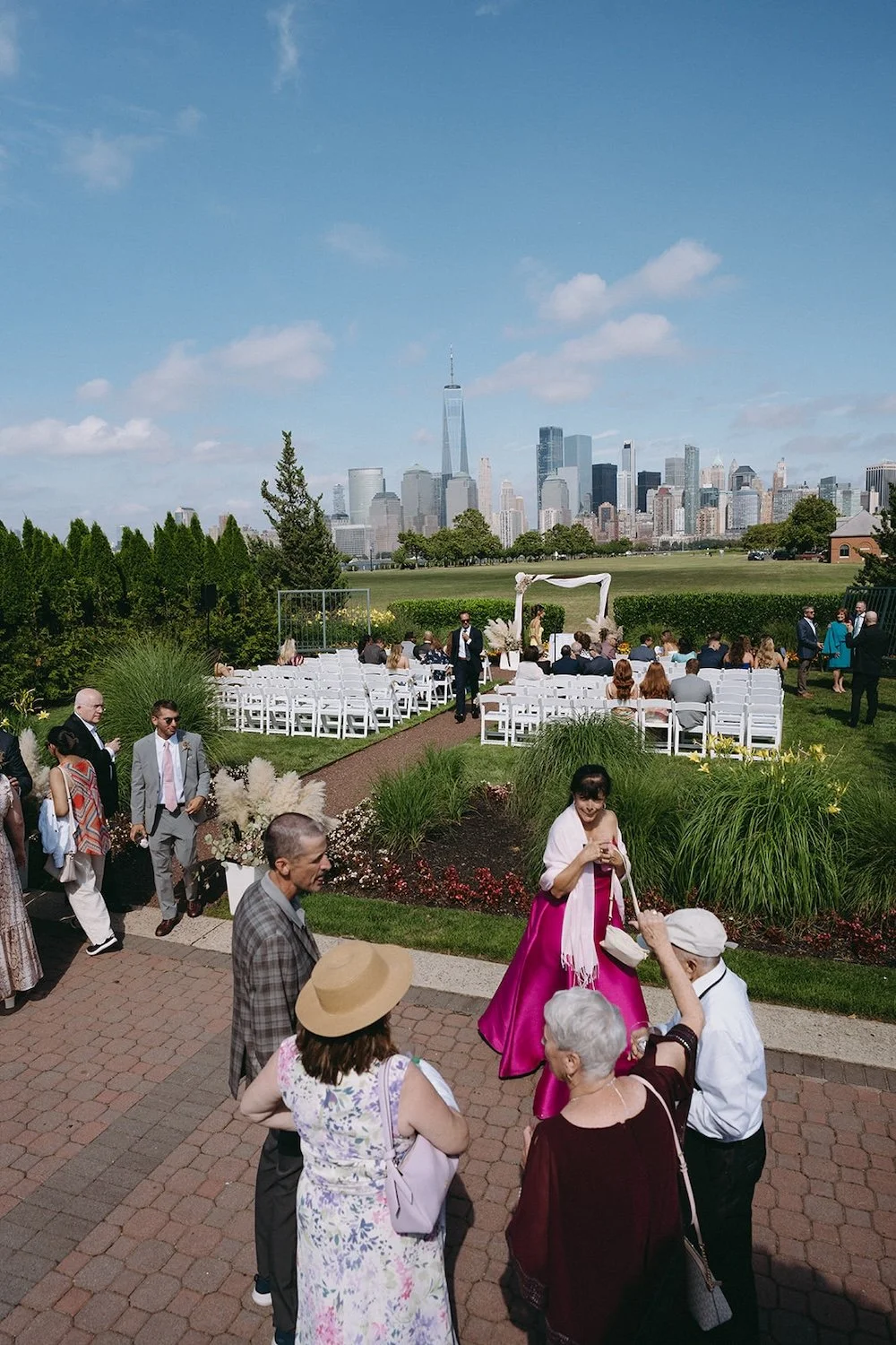 Family and friends gathering to find their seats for the wedding ceremony. 