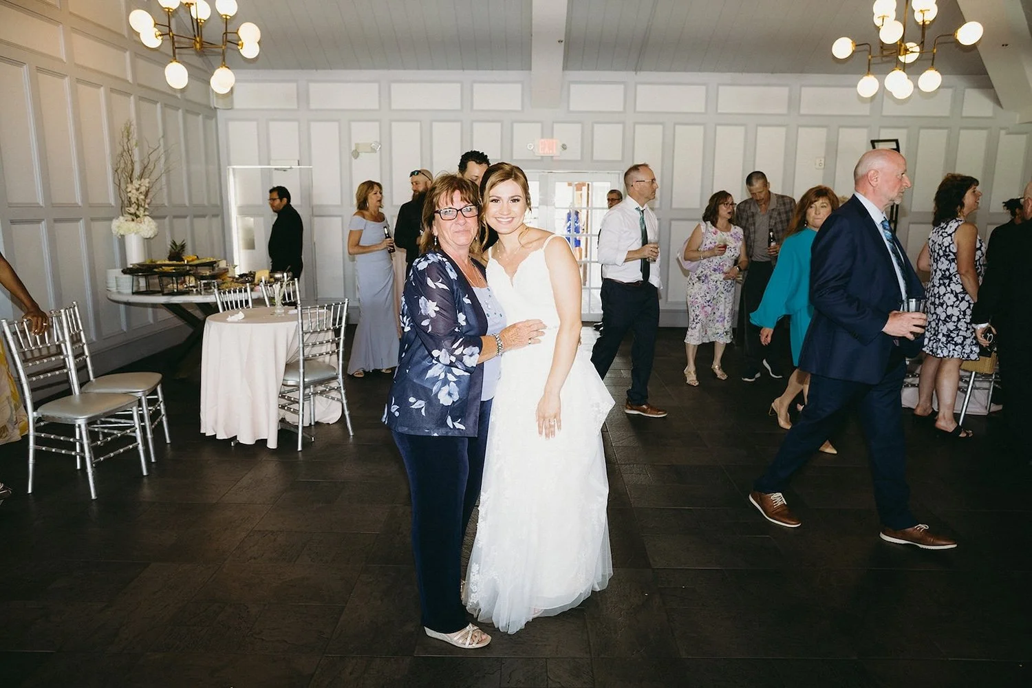 The bride poses with a guest of the wedding. 