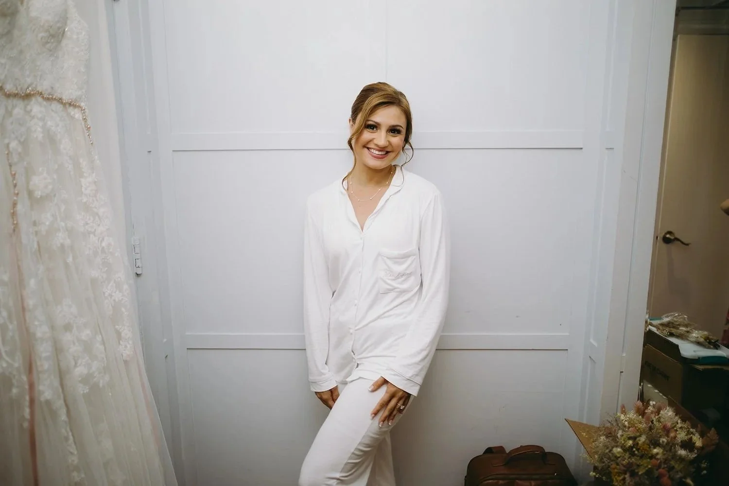 The bride poses in her embroidered wedding day attire.
