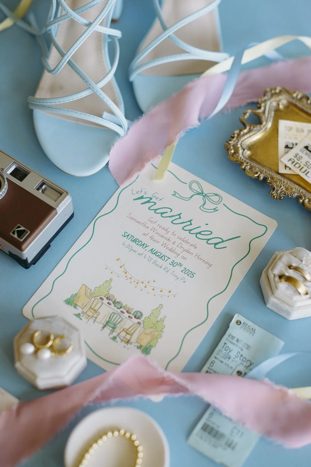 Detail photo of the brides wedding items with shades of baby blue and pink. 