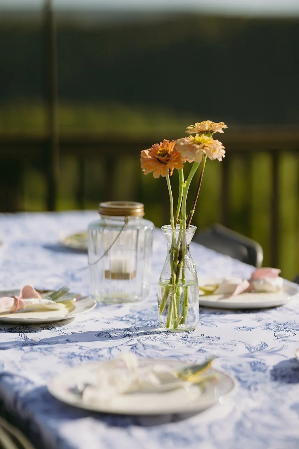 Colorful tablescape with shades of blue, white and wild florals. 