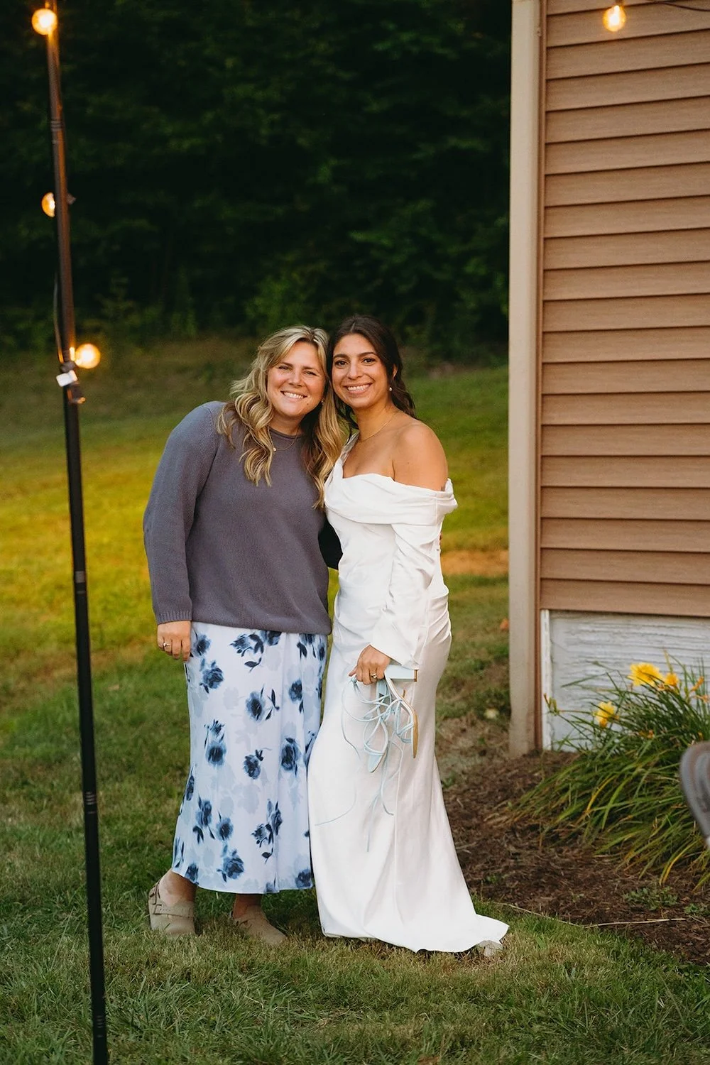 The bride poses with one of her wedding guests. 