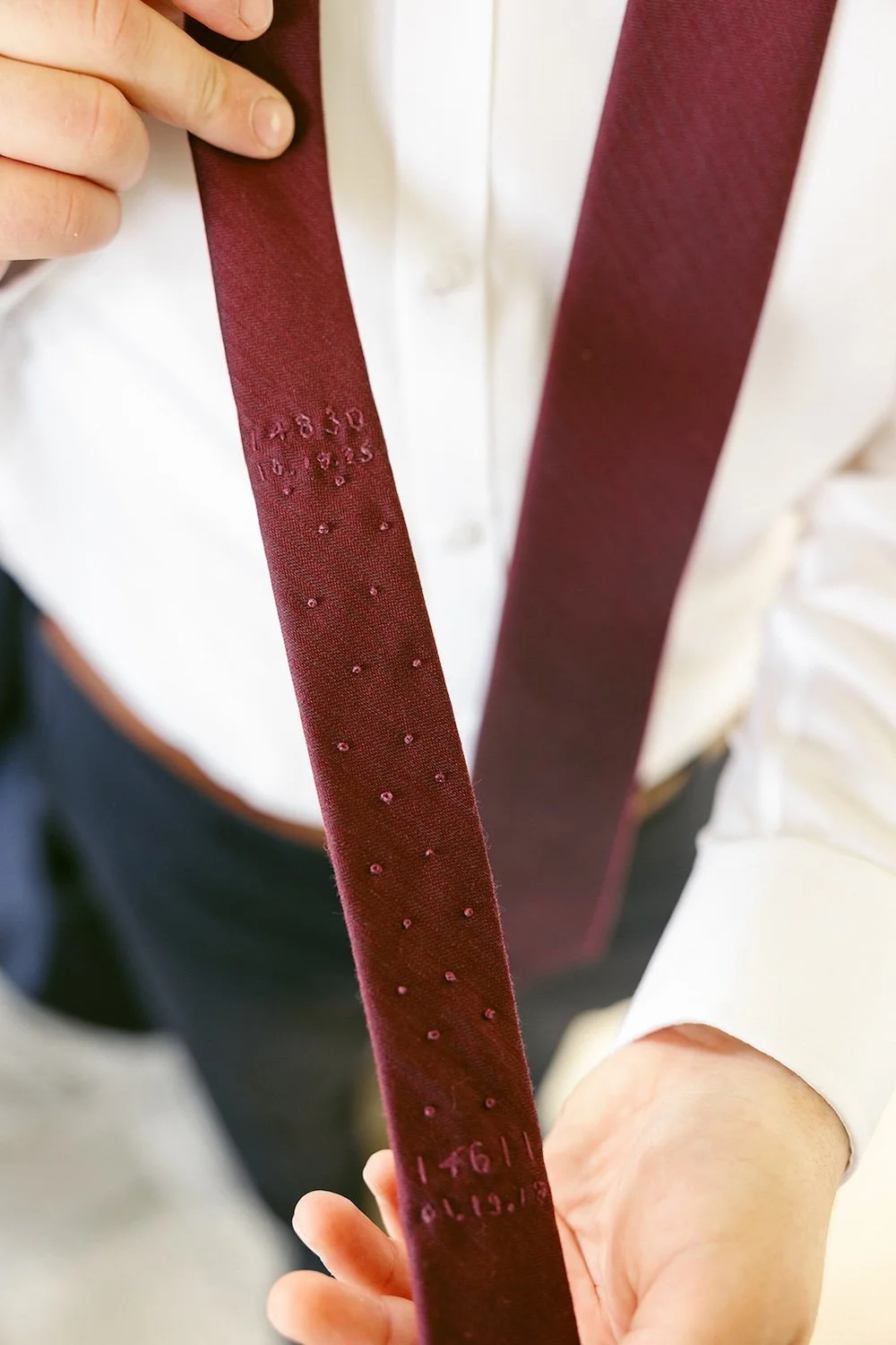 Detail photo of the groom's wedding tie. 
