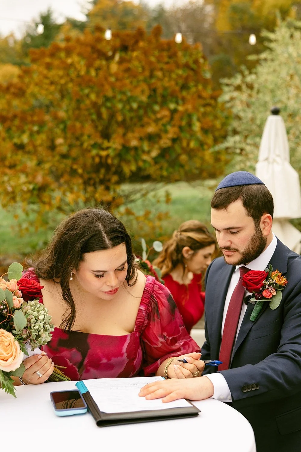Family and the groom signing the marriage contract. 
