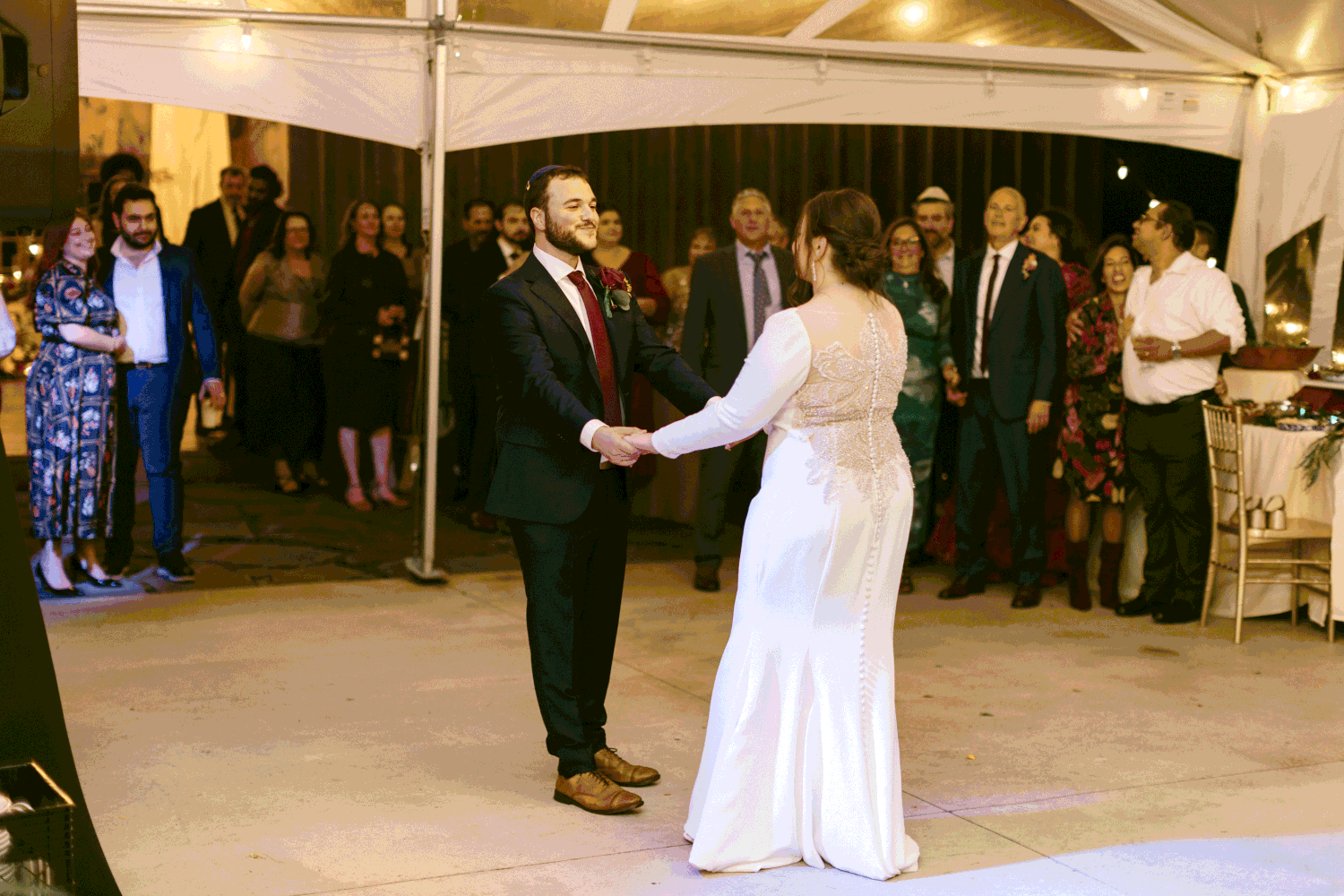 The bride and groom sharing their first dance together. 