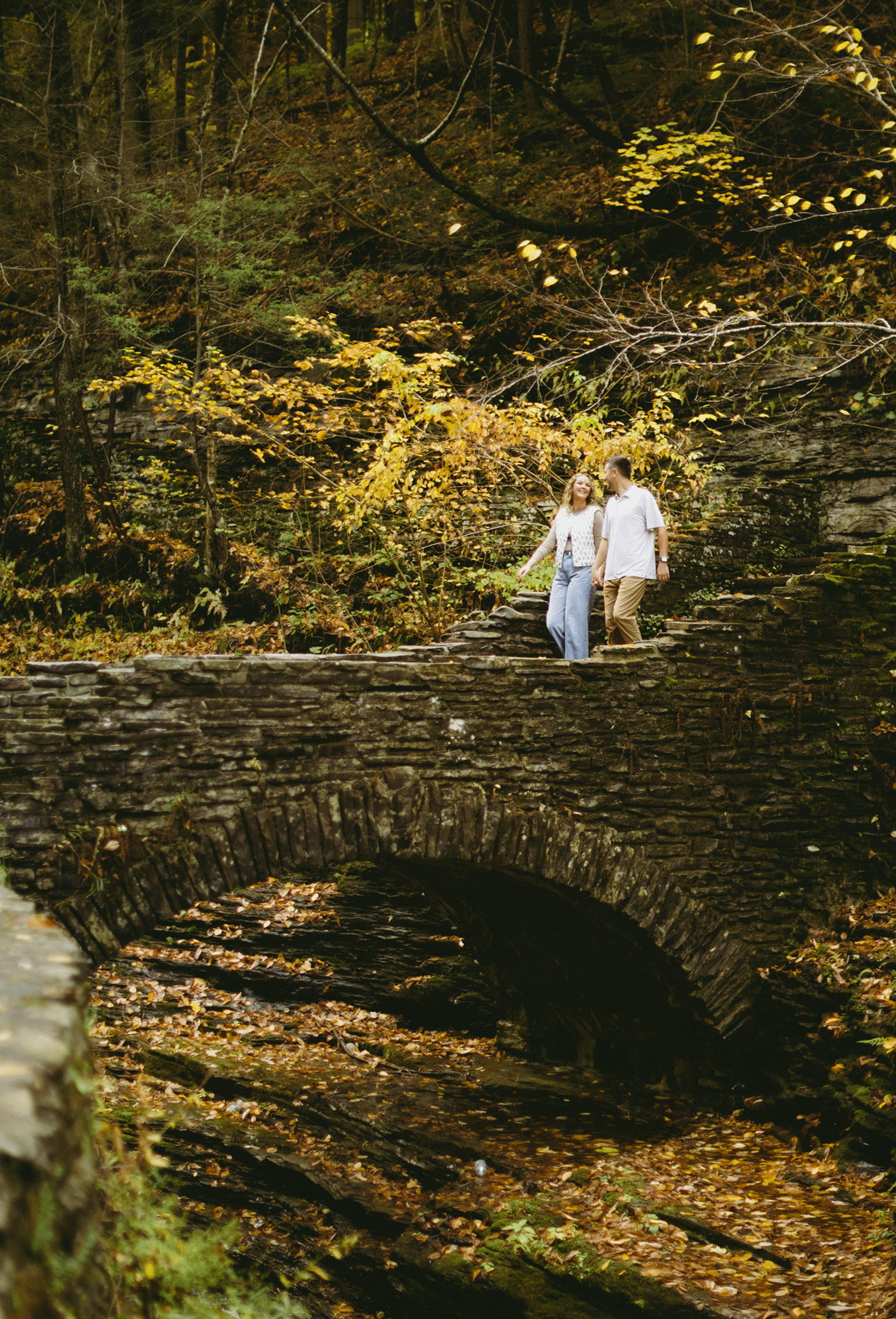 Live photo of the couple walking the bridge crossing the gorge. 