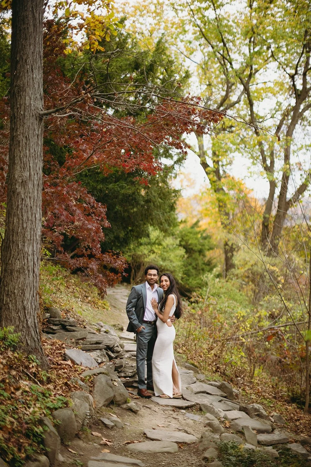 The couple walk up the stepping stones surrounding the church. 