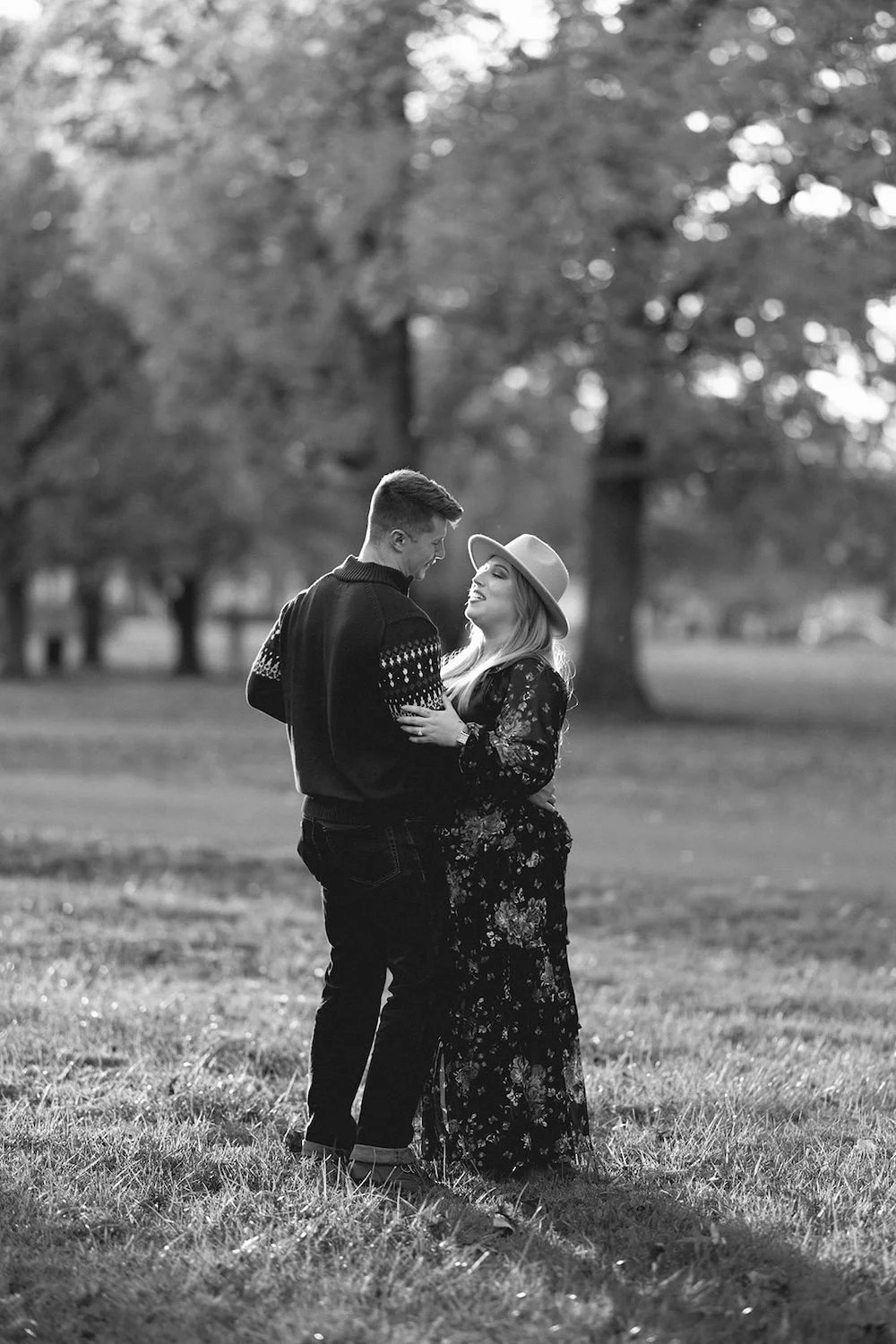 Black and white photo of the couple dancing together. 