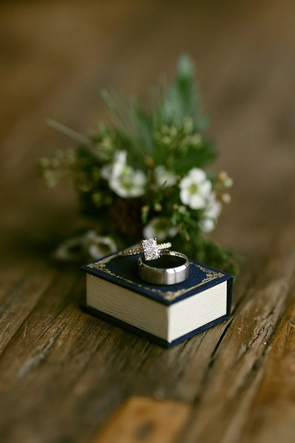 Detail photo of the wedding bands resting atop the box.