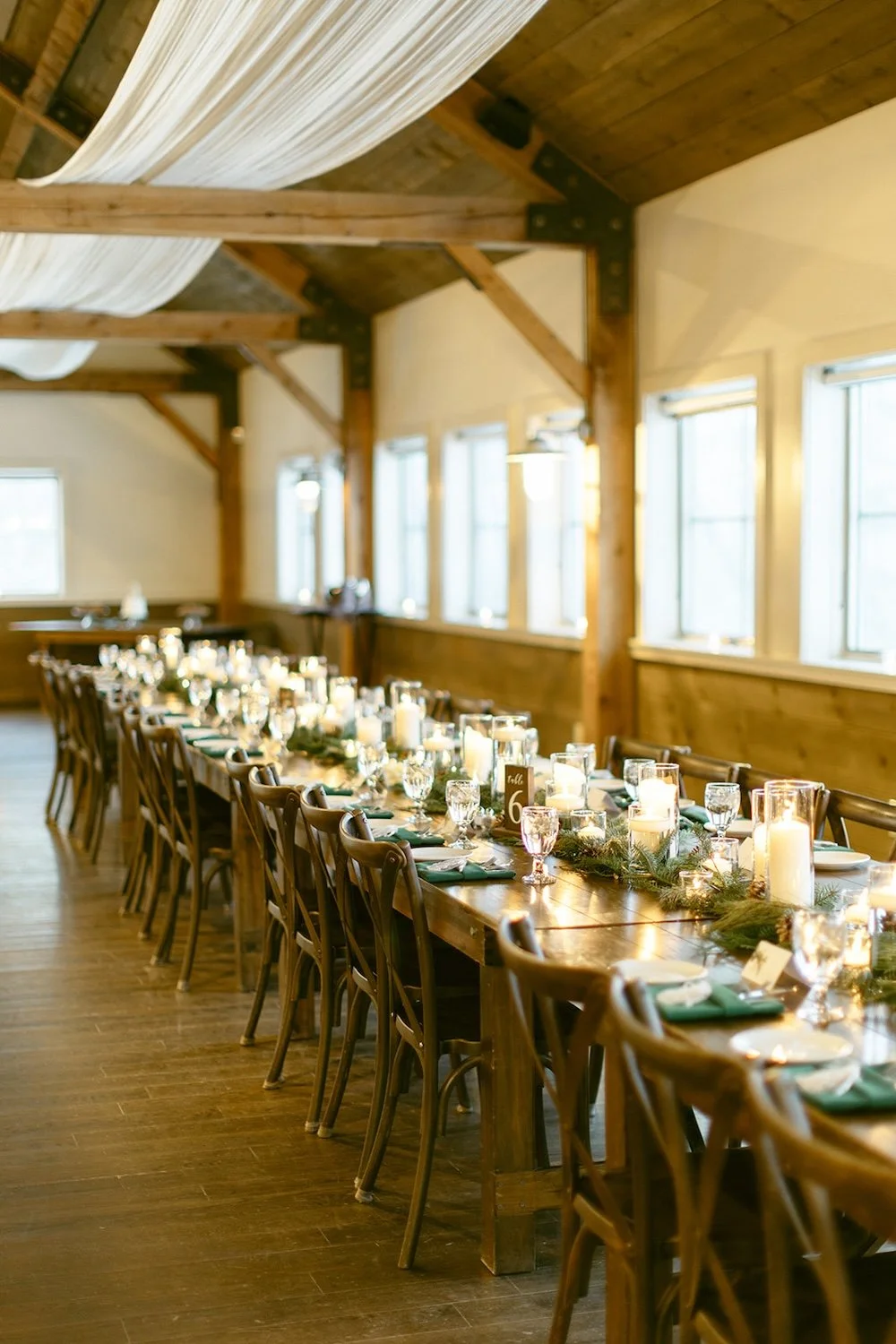 Family style table set for the couples wedding guests. 