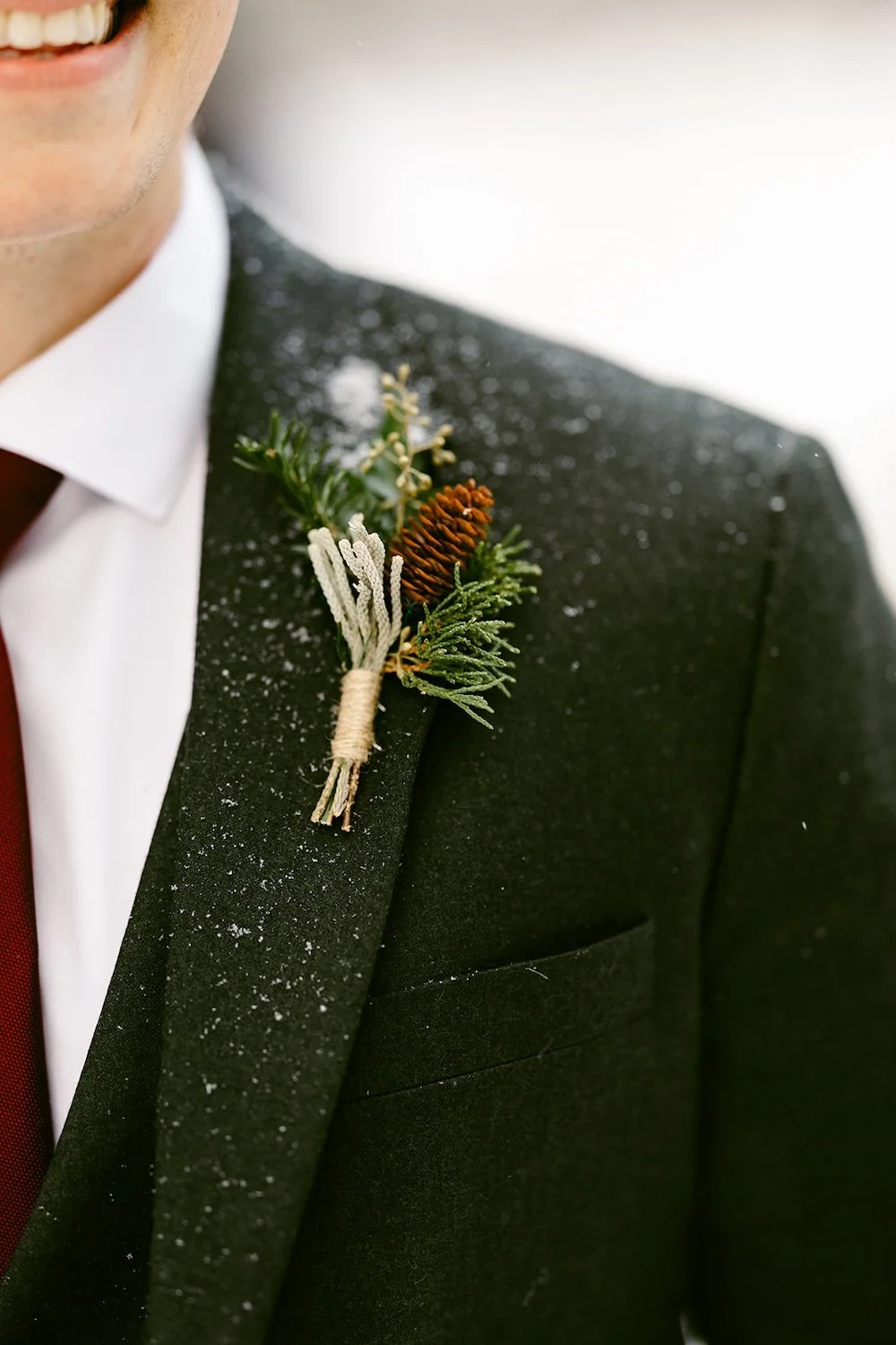 Detail photo of the grooms boutonnière. 