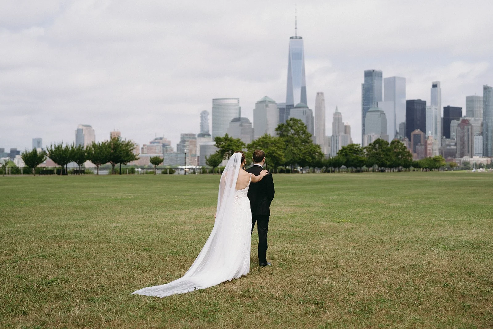 Romantic wedding first look with bride and groom sharing a private moment