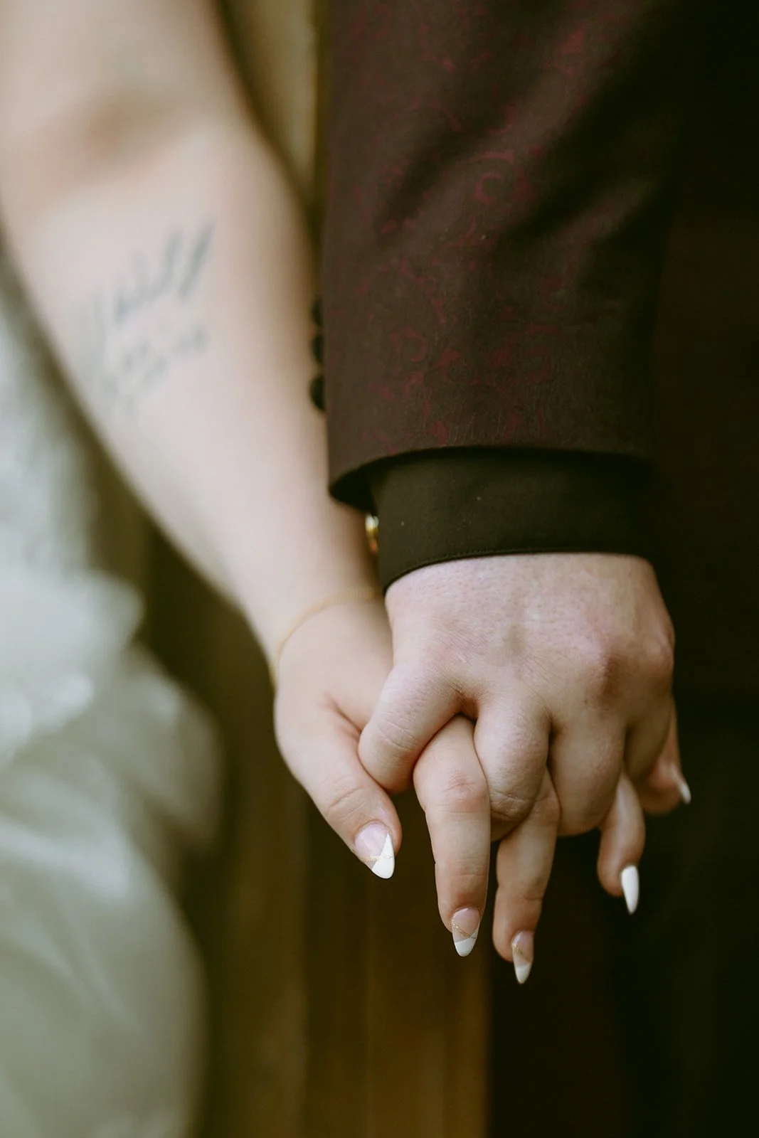 A man and a woman having first touch before their wedding