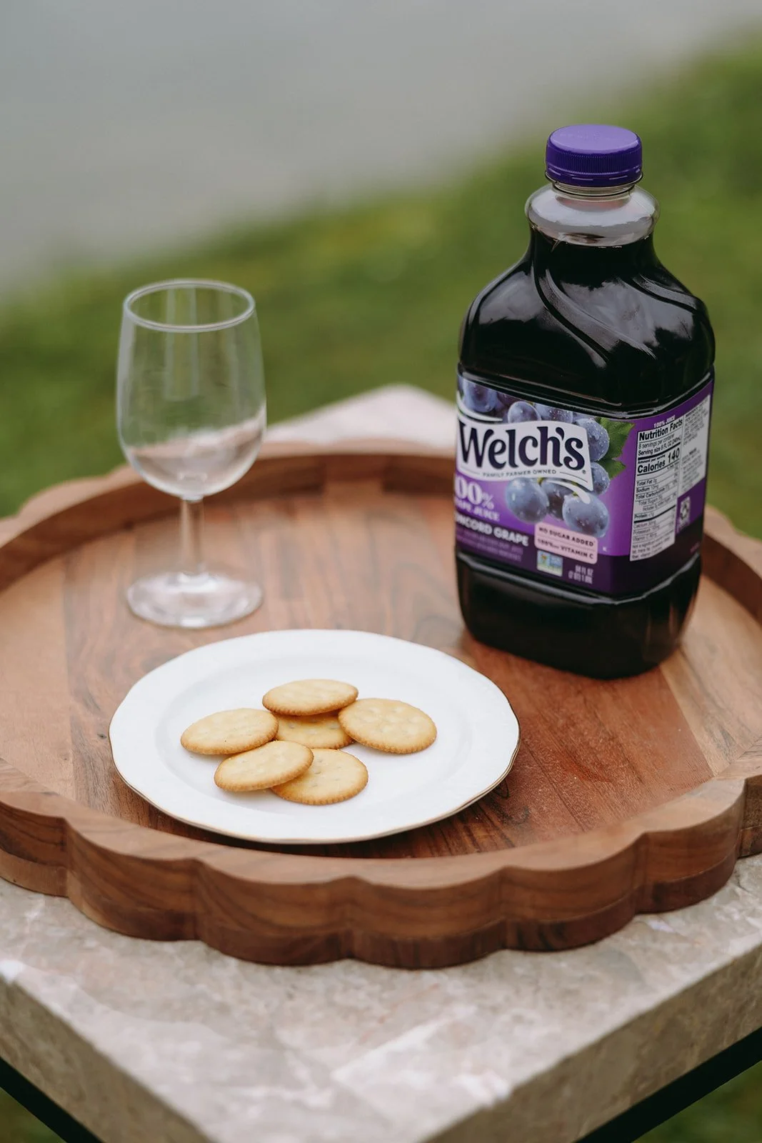 a cup, juice and rackers on a wooden table for a comunion for a christian wedding | christian wedding ceremony ideas