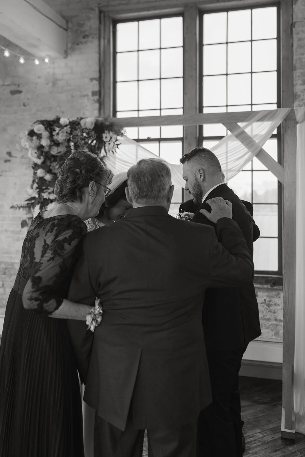 4 people praying together at christian wedding ceremony