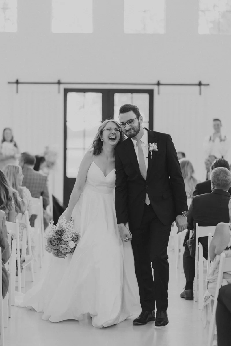 Bride and groom sharing a moment of worship during their ceremony, one of many meaningful Christian wedding ceremony ideas.