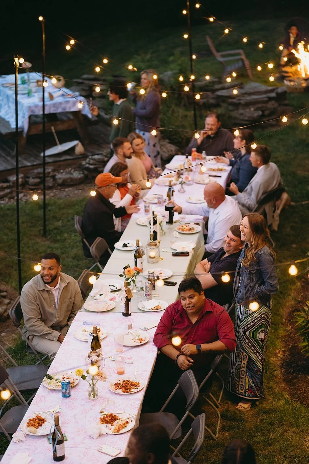 View of the guest's sitting and mingling at the family style table.