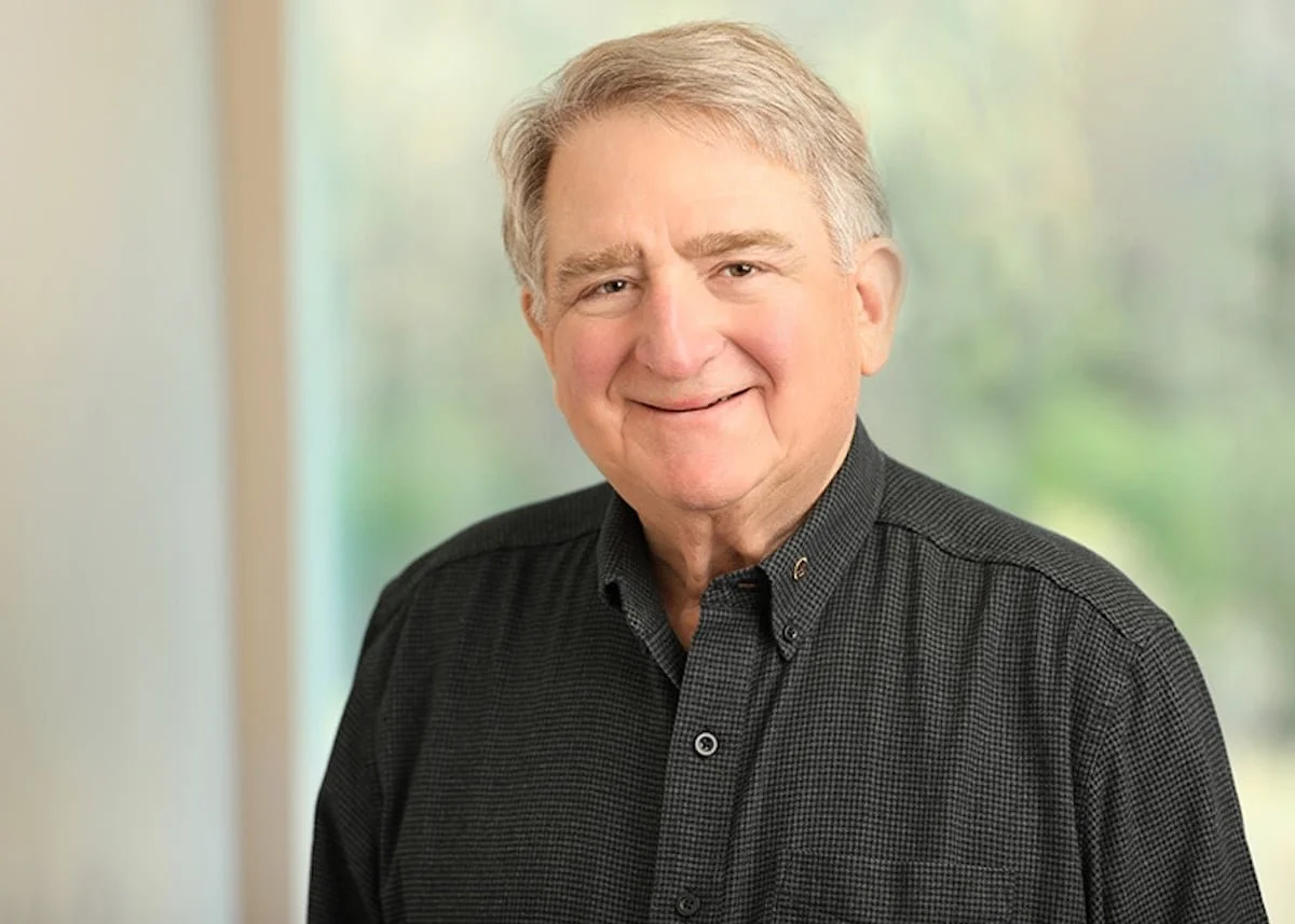 Headshot of Jim Nelson, Board President of Onward Eden Prairie, smiling in front of a softly blurred window background.