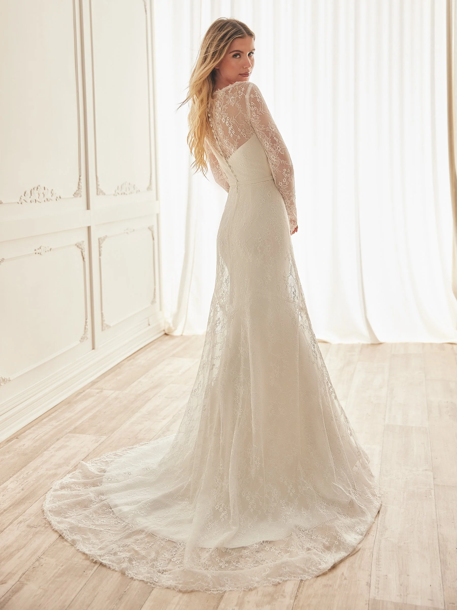 M2551 Long sleeve lace overlay with strapless crepe gown.