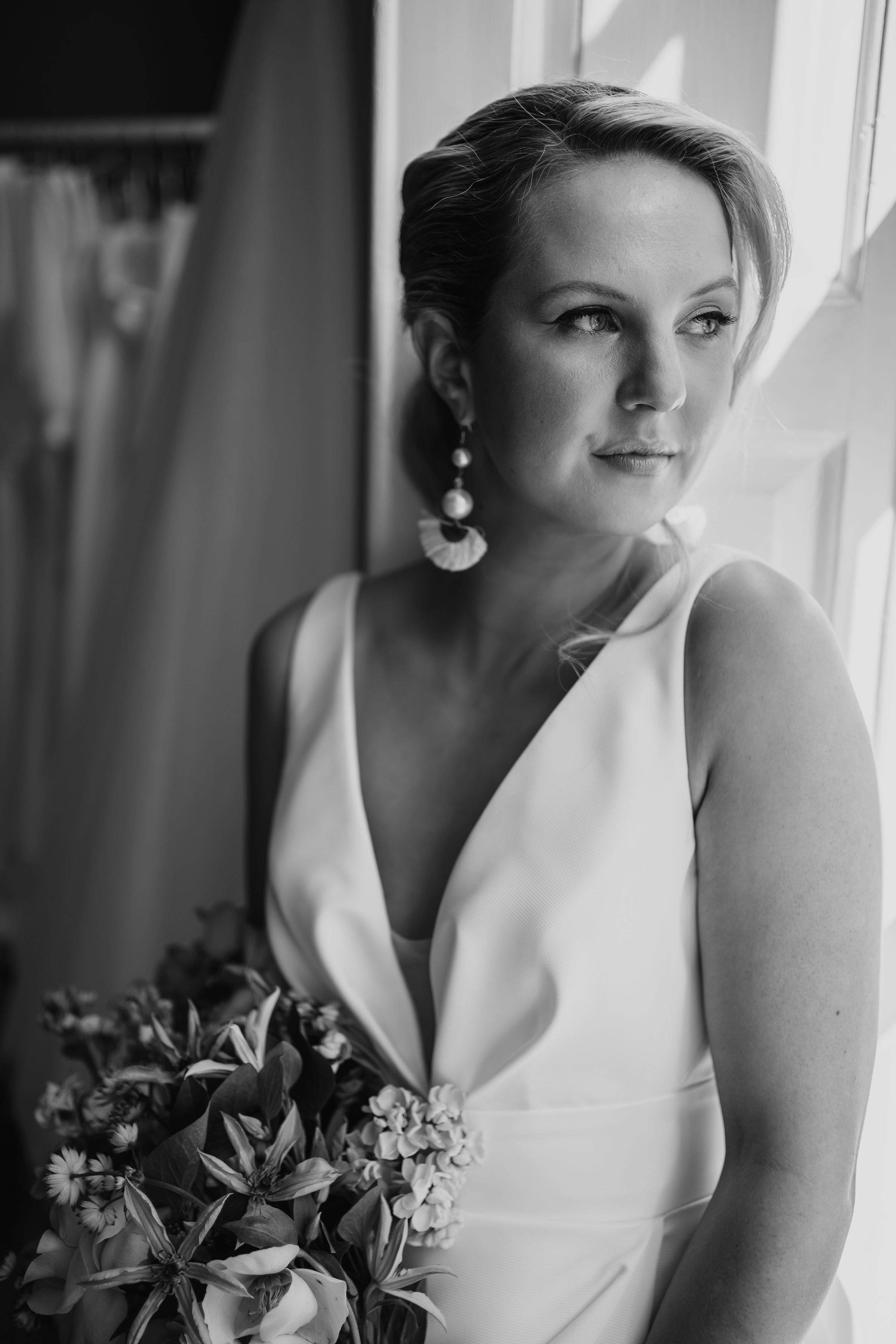 B&W image of Mikaella 2430 styled shoot in Lavender & Jude, Suffolk. Photography by Holly Hambling-Hair by hair by Alice-Makeup by Hayley Clarke-flowers Emma Quinn