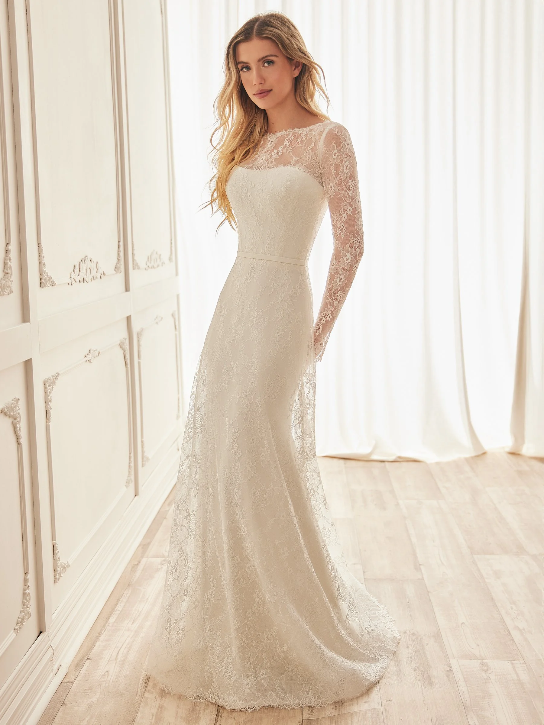 M2551 Long sleeve lace overlay with strapless crepe gown.