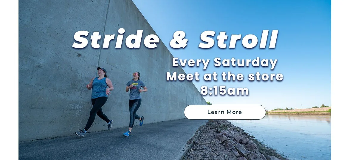 Two women jogging along a riverbank path with a concrete wall on one side and water on the other, advertisement for a weekly walk event at 8:15 am.