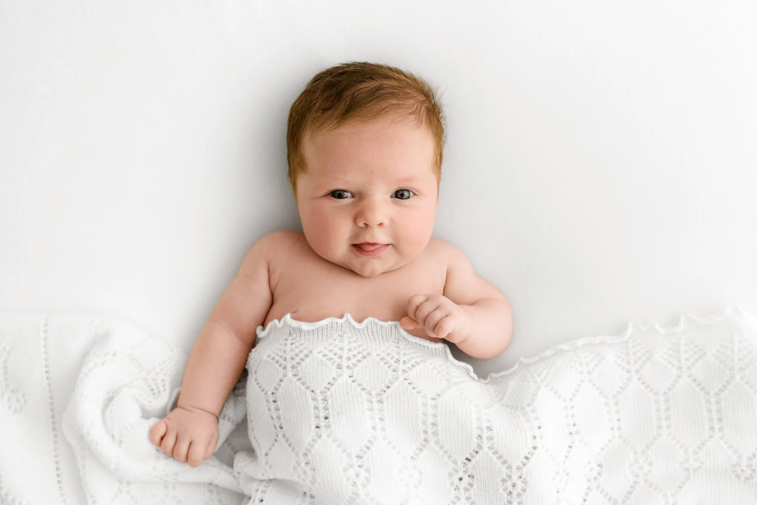 awake smiling baby at Natural prop free newborn baby photography at Mabel and Moose studio Monifieth Dundee