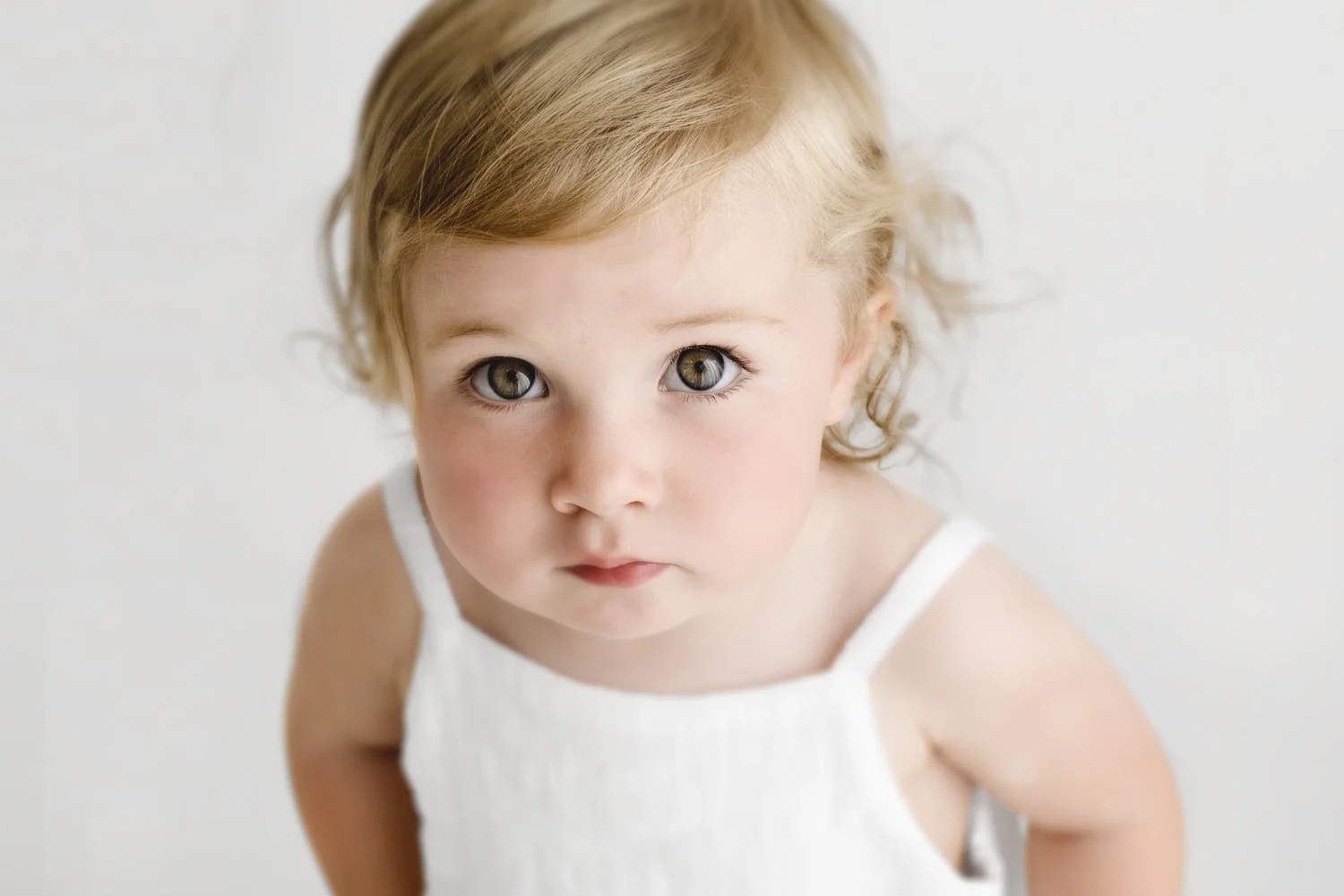 15 month baby girl looking at camera