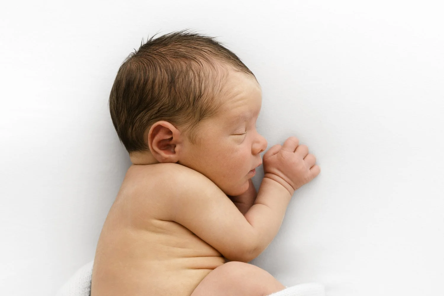 Sleeping newborn baby photographed at Mabel & Møøse natural newborn photography studio