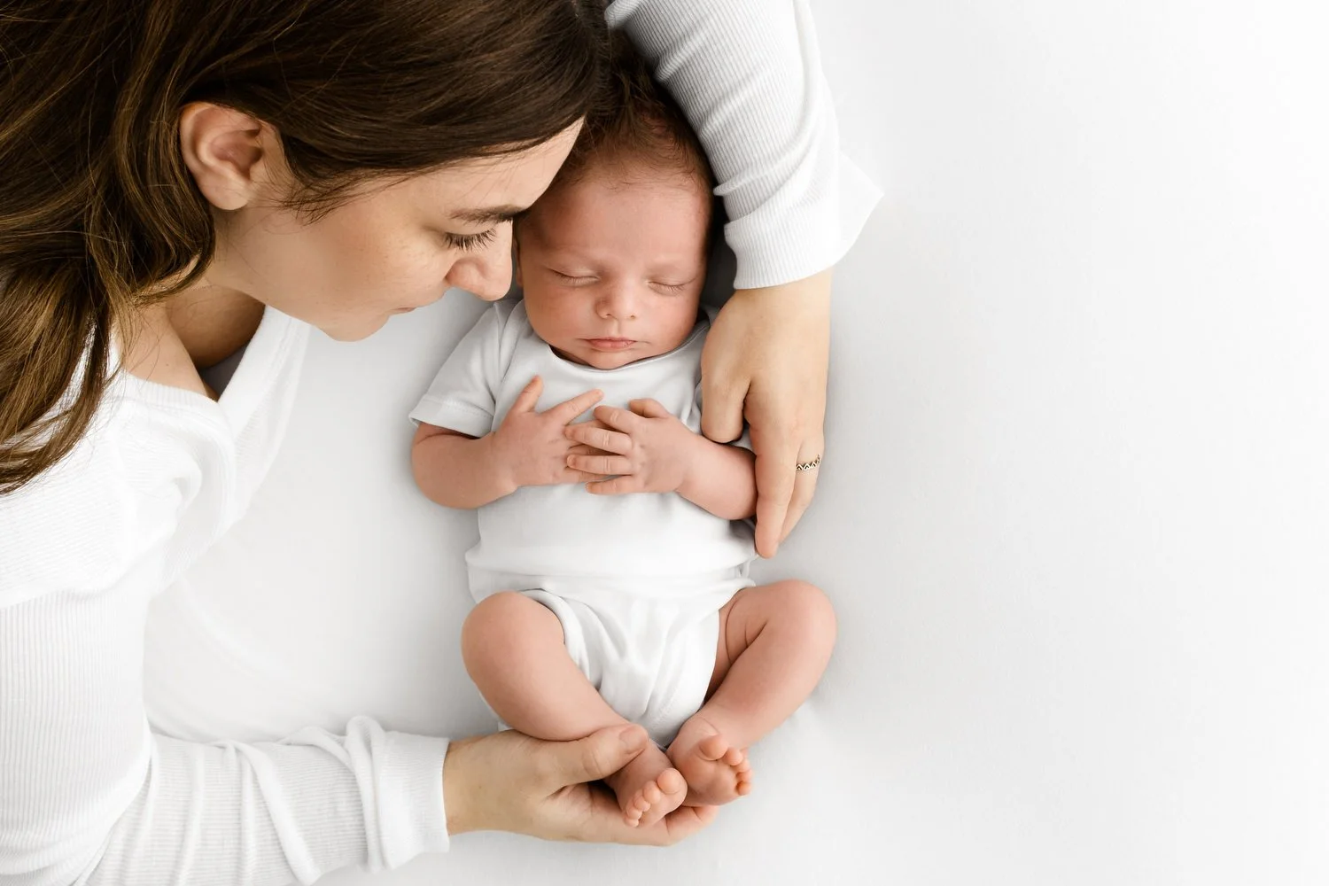 mum holding newborn at Natural prop free newborn baby photography at Mabel and Moose studio Monifieth Dundee