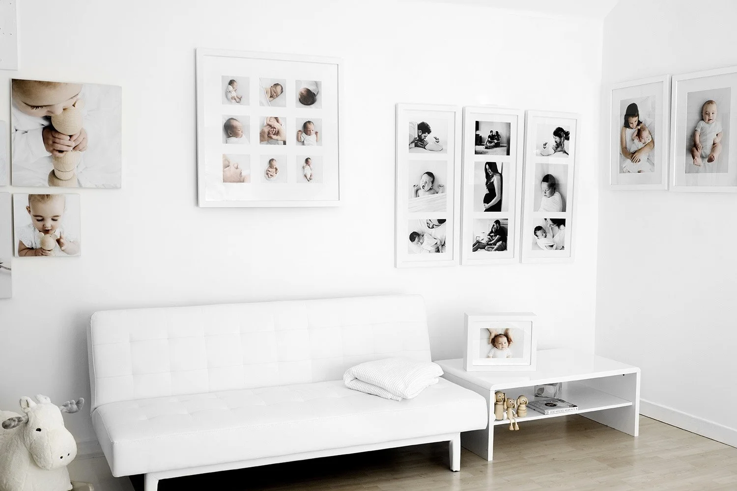 Framed newborn portraits displayed on studio wall at Mabel & Møøse Dundee