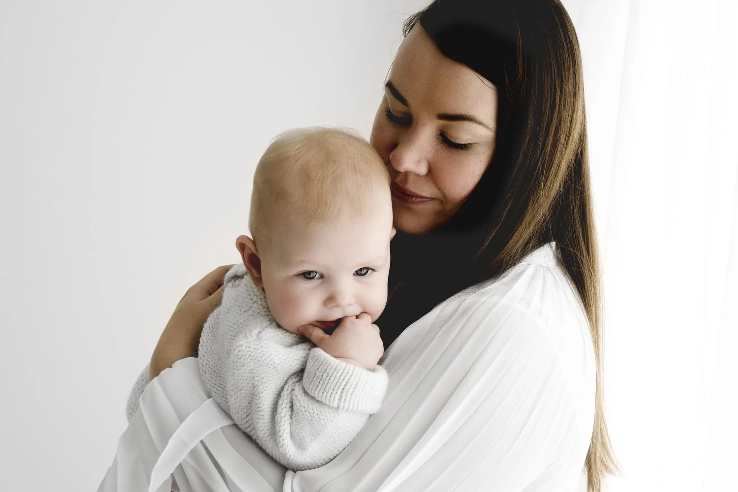 dad hugging 9 month old baby at relaxed photography studio in dundee