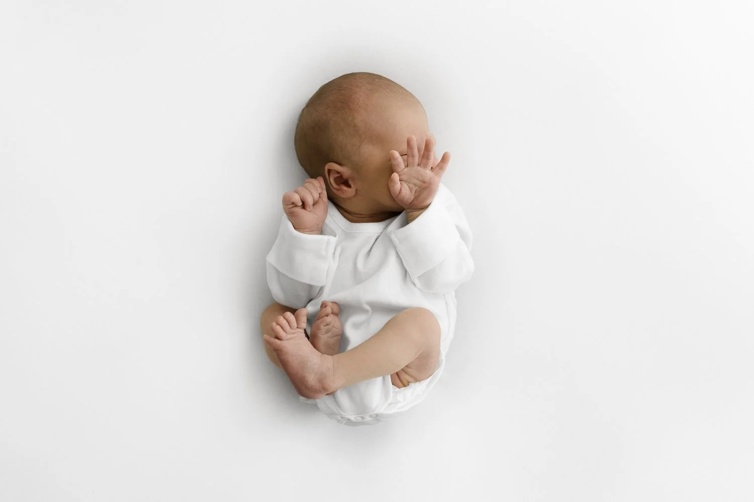 Plain white baby bodysuit for a newborn photoshoot at Mabel and Moose Dundee