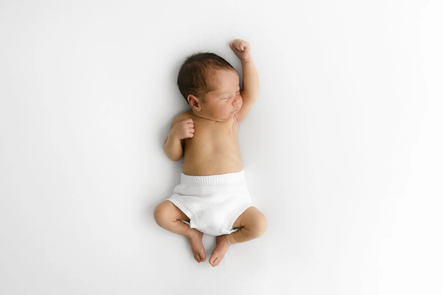 Newborn baby sleeping peacefully at Mabel & Møøse photography studio Dundee