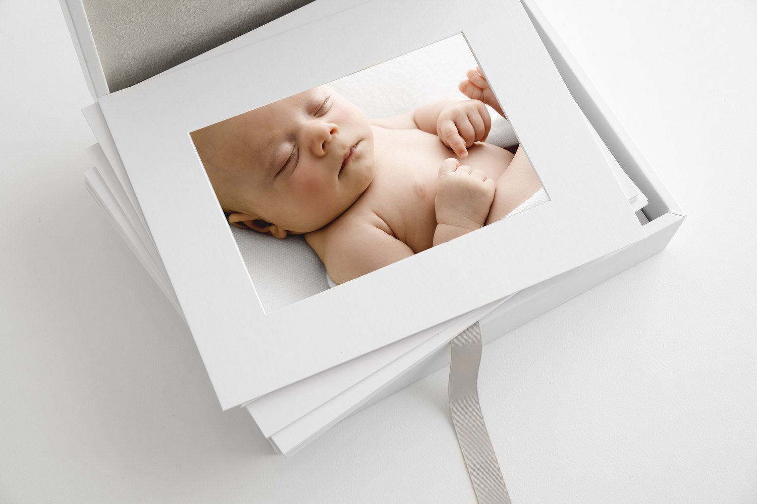 Newborn print collection box with mounted baby