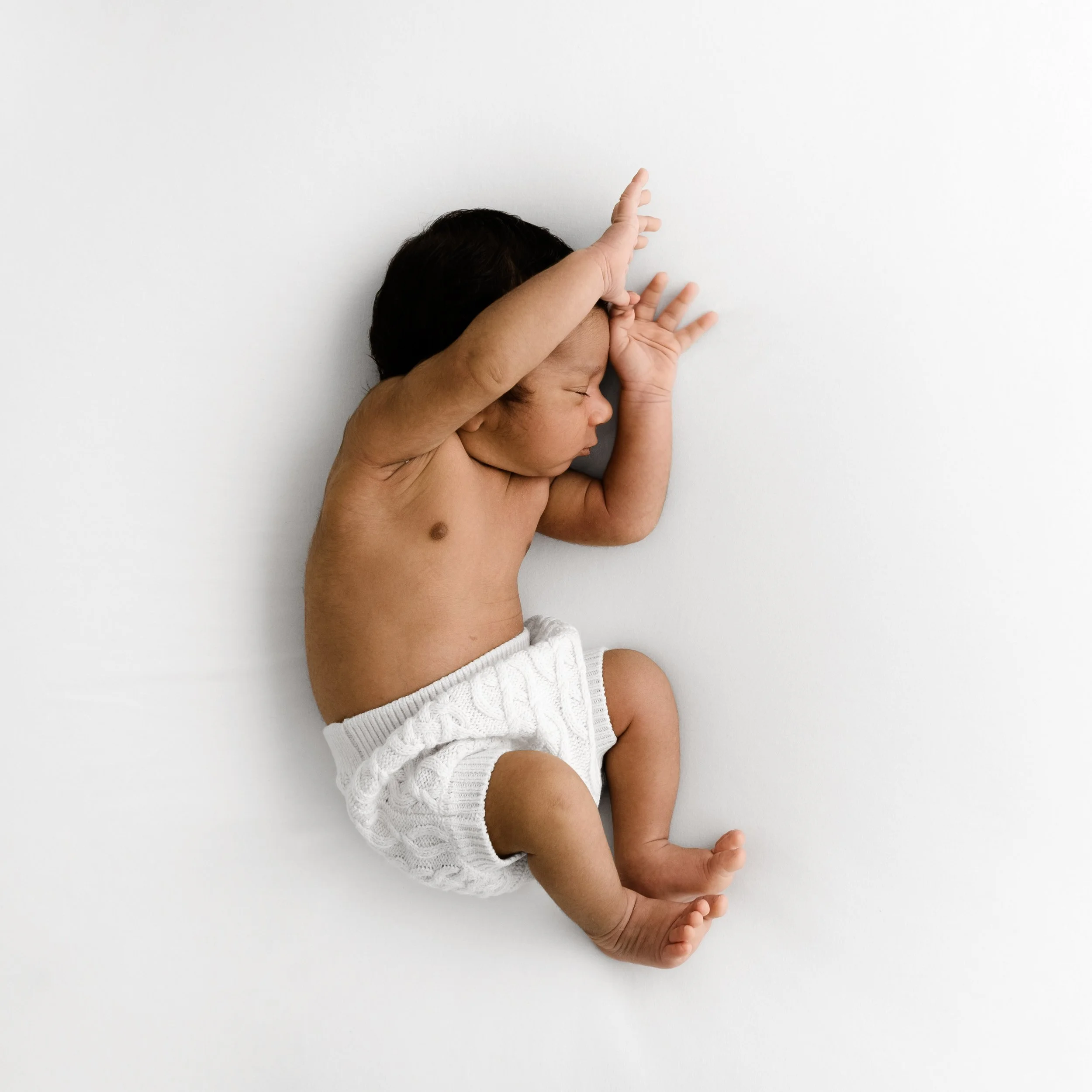 Newborn baby in simple white bloomers at natural photoshoot Mabel and Moose Dundee