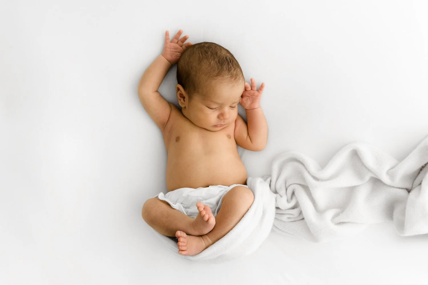 Heartwarming portrait of a peaceful baby captured at Mabel and Moose Studio