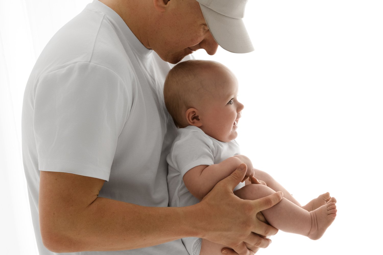 dad holding 6 month old baby photoshoot at Mabel and Moose studio Dundee