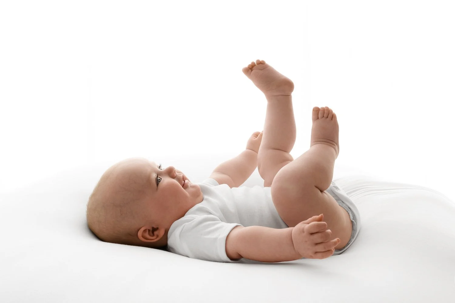 6 month old baby lying on back  photoshoot at Mabel and Moose studio Dundee