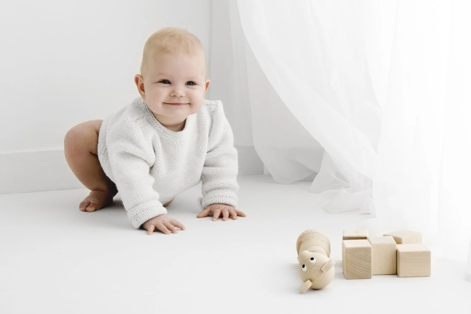 9 month old baby crawling during natural baby photoshoot in Dundee