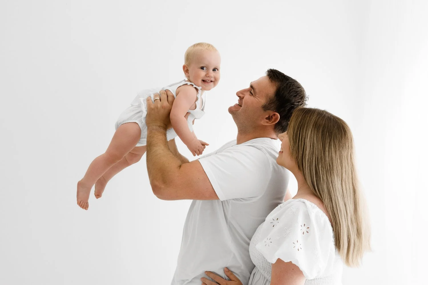 Family enjoying a fun, calm first birthday photoshoot in dundee Scotland