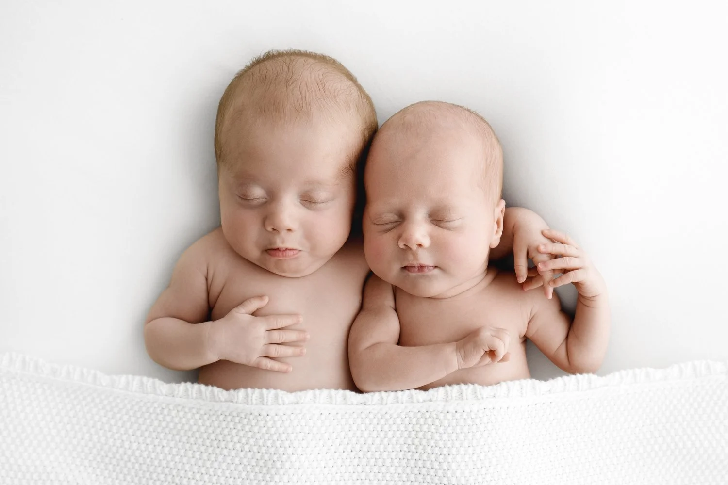 Newborn twin babies snuggling together natural photography Dundee