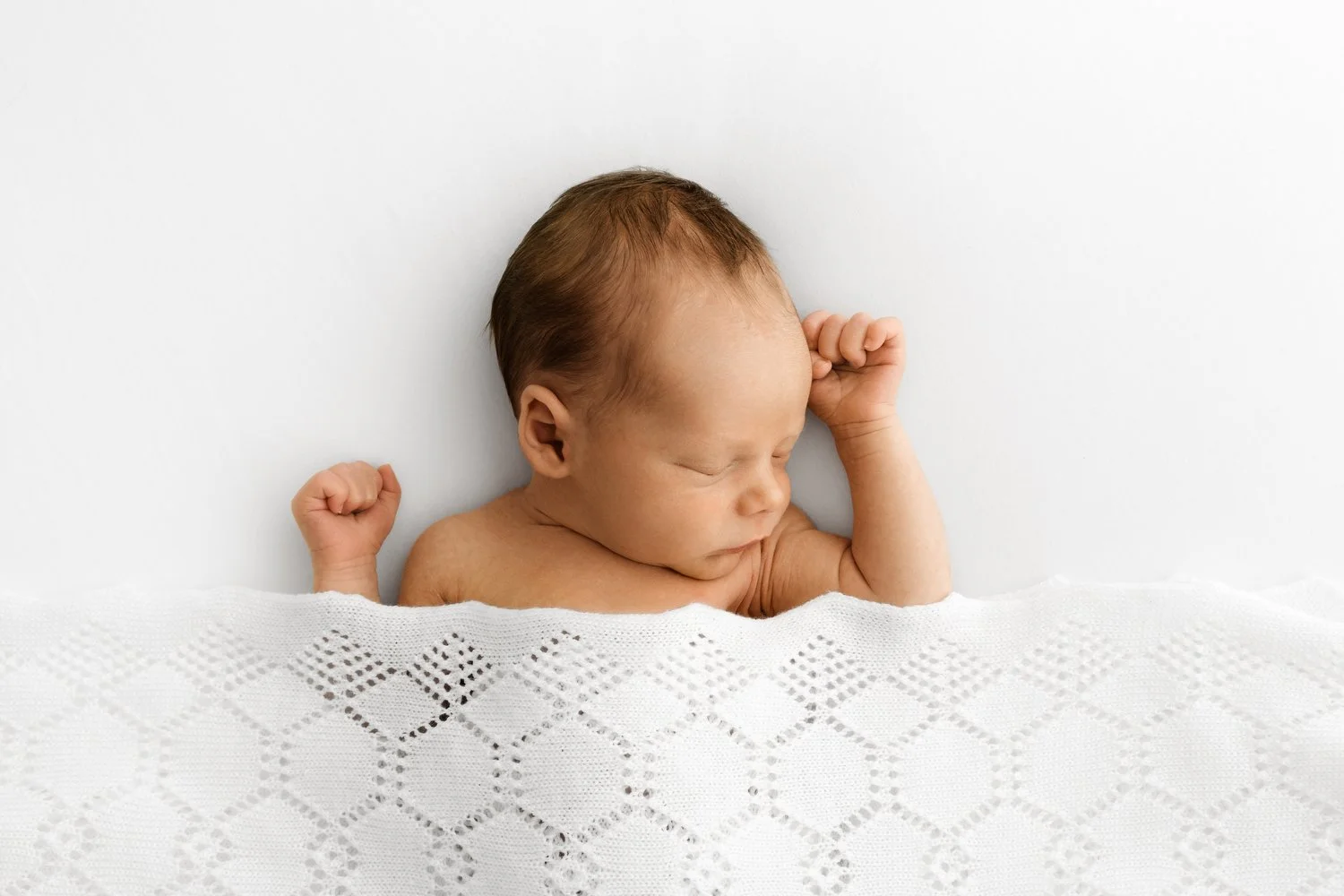 Sleeping newborn baby under white lace shawl at Little Møøse Session Mabel and Moose Dundee