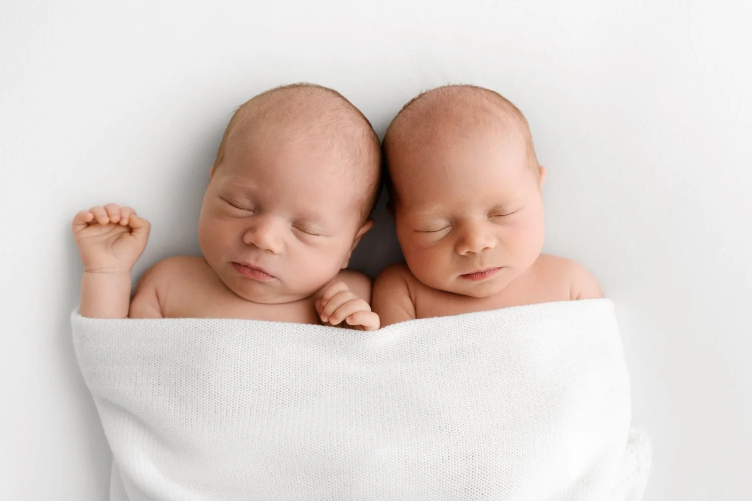 Twin newborn babies photographed naturally at Mabel and Moose Dundee