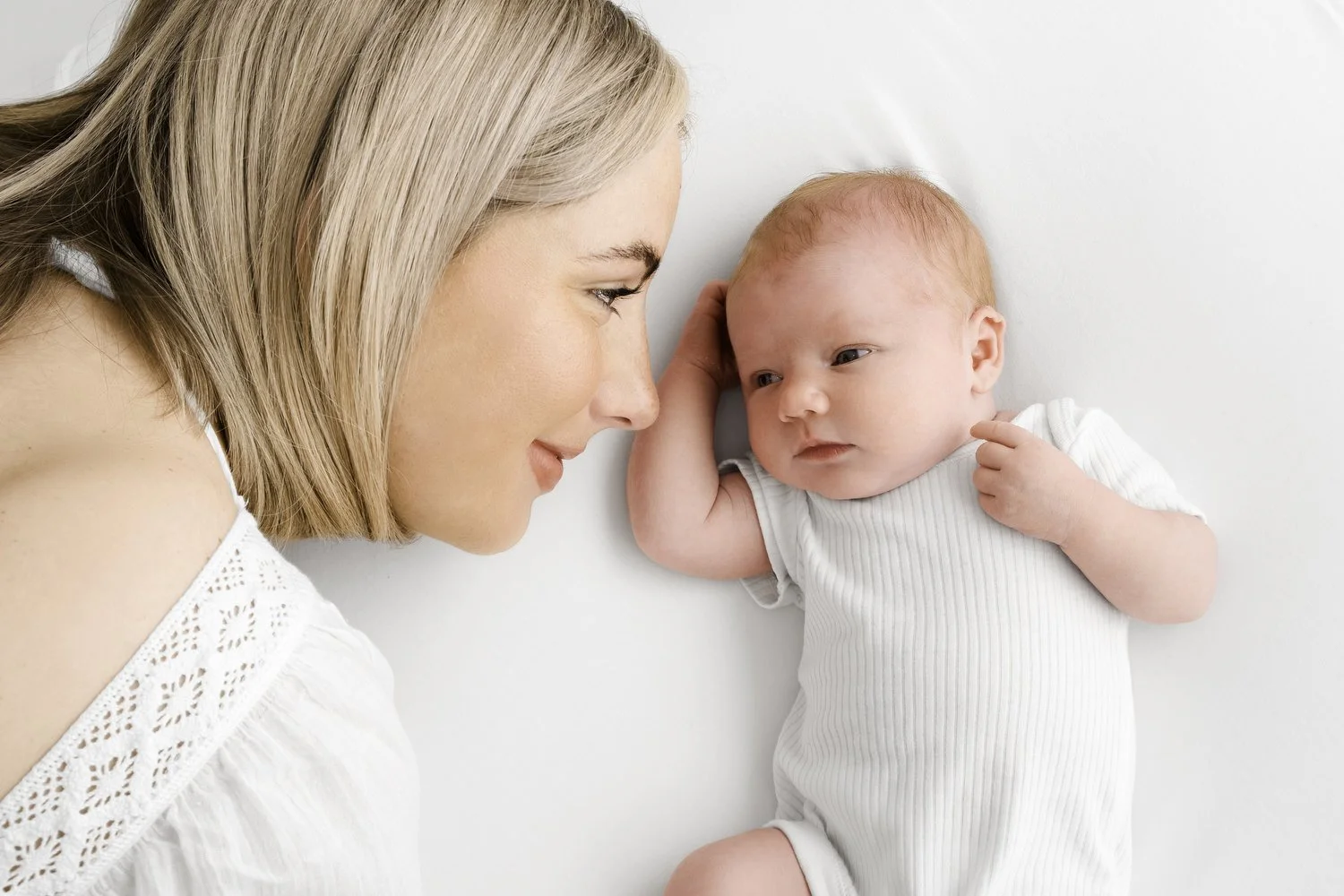 Older baby in white short sleeved vest at Mabel and Moose photography Dundee