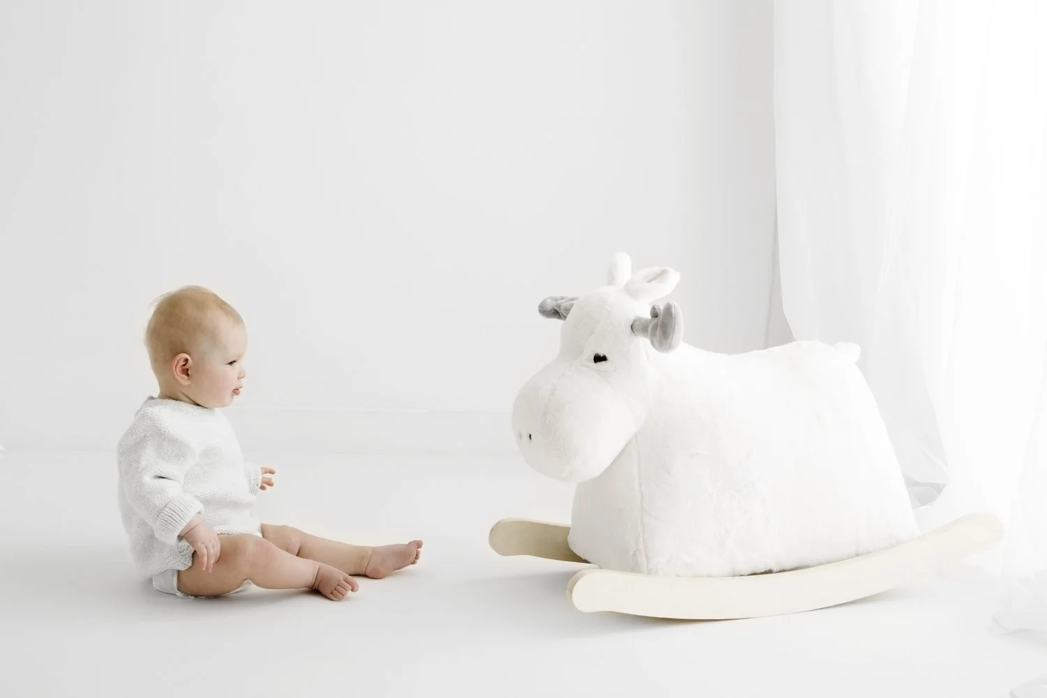 9 month old baby sitting during natural baby photoshoot in Dundee